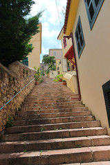 Fototapeta na wymiar Long stairway street in Nafplio, Peloponnese, Greece