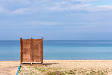 Dressing cabin on the beach. Minimal work with sea, sky and locker cabin