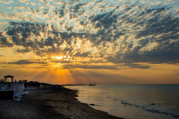 Fototapeta premium Sunset at the sea in the summer resort