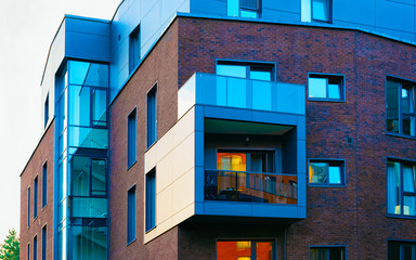 Apartment in residential building exterior. Housing structure at blue modern house of Europe. Rental home in city district on summer. Architecture for business property investment, Vilnius, Lithuania.