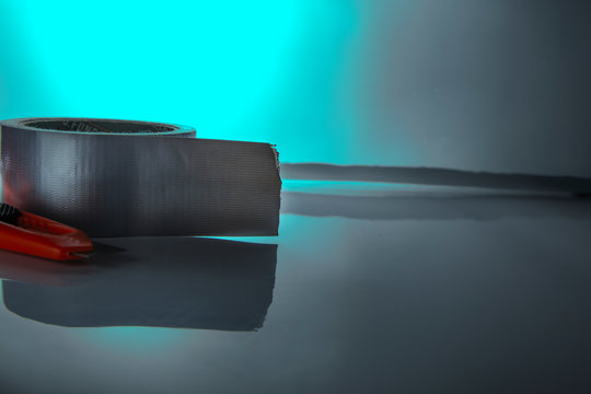 cutter and tape  with blue light background 