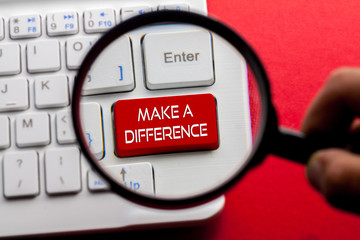 Make A Difference word written on keyboard view with magnifier glass