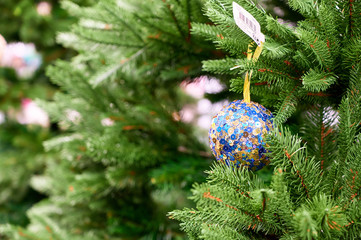 Photo of christmas tree decoration for new year and christmas. Bright lights and colors, festive mood. The concept of a happy meeting of Christmas and New Year.