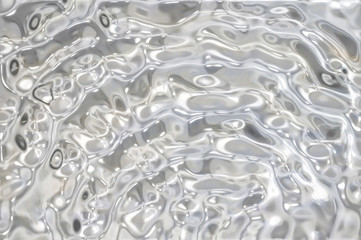 Metallic silver wavy background.