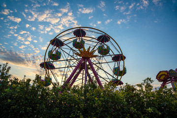 Rotating Russian wheel amusement ride in the summer