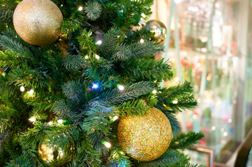 Obraz na płótnie Canvas Photo of christmas tree decoration for new year and christmas. Bright lights and colors, festive mood. The concept of a happy meeting of Christmas and New Year.