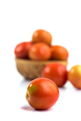 Fresh tomatoes on white background.