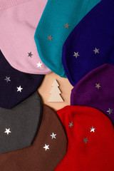 flatlay, colorful hats lined up in a circle, composition, top view, sparkles, decor