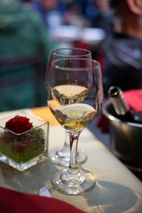 Two glasses of white wine on table in restaurant