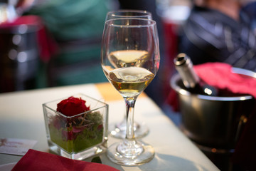 Two glasses of white wine on table in restaurant