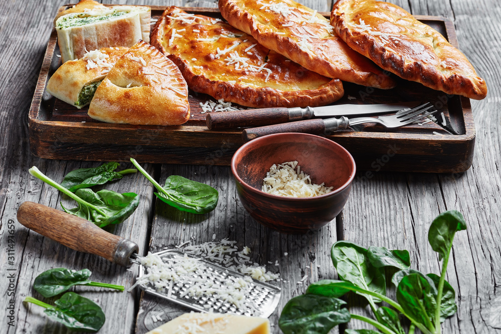 Sticker close-up of calzones wth spinach and cheese