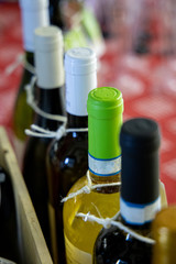 Wine bottles in a row with limited depth of field