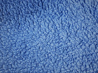 close-up of decorative abstract wall surface with blur / bokeh effect in classic blue color