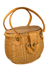Women's bag in the form of a wicker basket of vines on an isolated white background.
