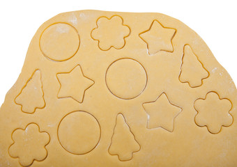 raw dough with cookie shapes