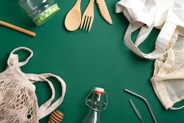 Set of Eco friendly bamboo cutlery, reusable canvas shopper bag, glass jar and bottle, string bag, metal drinking straws. Zero waste, plastic free concept. Sustainable lifestyle. Eco shop banner.