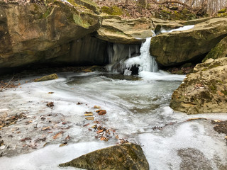frozen waterfall in forest