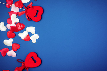 Red heart for Valentine's Day on a beautiful blue background. Heart pendant. Space for text. Red heart. Valentine Day.