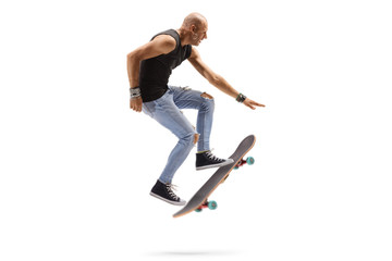 Male skateboarder jumping with a skateboard