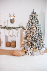 Christmas tree with gifts in the bright living room