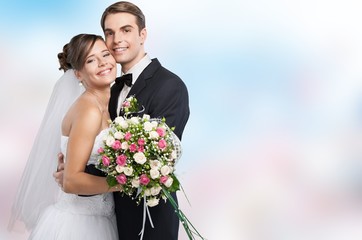 Happy just married young couple on blurred  background