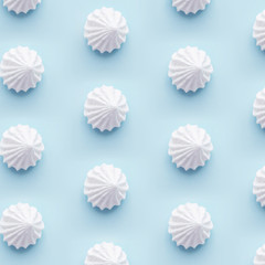 White meringue cookies pattern on blue