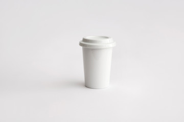 white take away cup in porcelain with lid