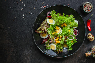 healthy salad corn, quail eggs, leaves mix salad  (healthy food, green vitamins) menu concept. food background. top view. copy space