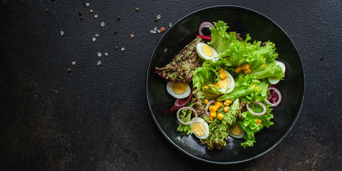 healthy salad corn, quail eggs, leaves mix salad  (healthy food, green vitamins) menu concept. food background. top view. copy space