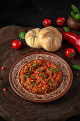 Healthy homemade creamy baked   eggplant caviar with spices, cream, tomatoes, pomegranate. Vegetarian food. Source of protein.