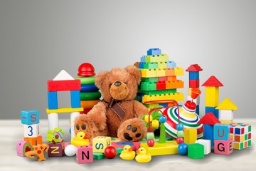 Many colorful toys collection on pastel background