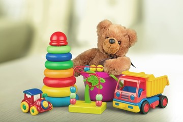 Many colorful toys collection on blur background