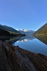 Naklejka na ściany i meble What a beautiful view to a reflection lake in Western Canada, near whistler. Typical canadian panoramic view with mountain in the background. So lovely.