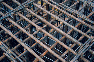Rebar for the construction of a monolithic building. Steel base of the house. Stock rebar at construction site.