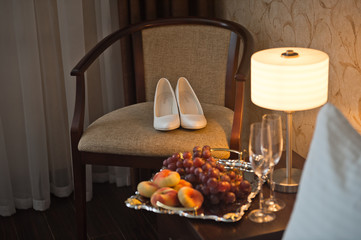 Wedding shoes on the chair waiting for the bride 2376.