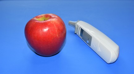 apple and syringe on white background
