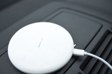  Mobile phone, smartphone charge battery ,wireless charging in the car plug close up