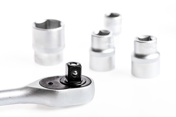 Ratchet tool. Steel chrome plated highly polished durable for long time use. Useful tools concept. Knob for socket wrench nut ratchet close up white background. Auto repair shops. Ratchet wrench