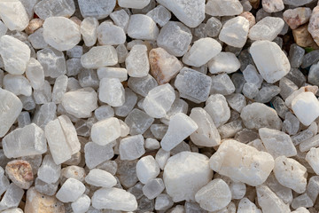 Quartz is a hard, crystalline mineral. White transparent pebbles, for decorating exteriors.