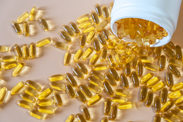 Fish oil pills. Omega 3 gel capsules. Healthy omega-3 tablets. Dietary supplement derived from...