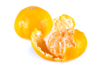 Open tangerine with slices on a white background. Mandarin.