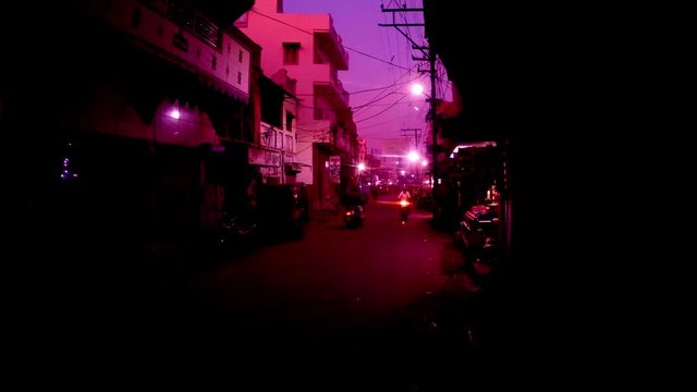 evening street traffic auto-rickshaw motobikes with headlights Bikaner Rajasthan