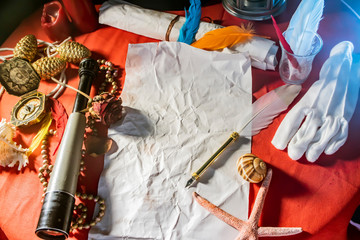 old quill pen on the old scroll paper. Historical atmosphere. Empty   place for a text