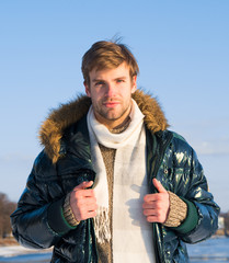 man enjoy sunny winter day. male seasonal fashion. cold and flu. male in down coat with fur hood....