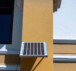 Small solar panel for attaching to the yellow house pillars, for saving electricity in the house