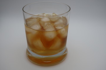 glass of whiskey with ice