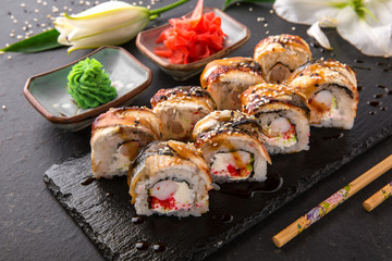 Unagi roll with smoked eel, with royal shrimp avocado, cream with Philadelphia cheese, tobiko caviar. Sushi menu. Japanese food. 