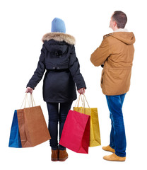 back view of couple with shopping bags