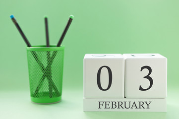 Desk calendar of two cubes for February 3