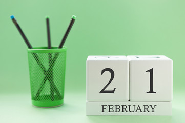 Desk calendar of two cubes for February 21